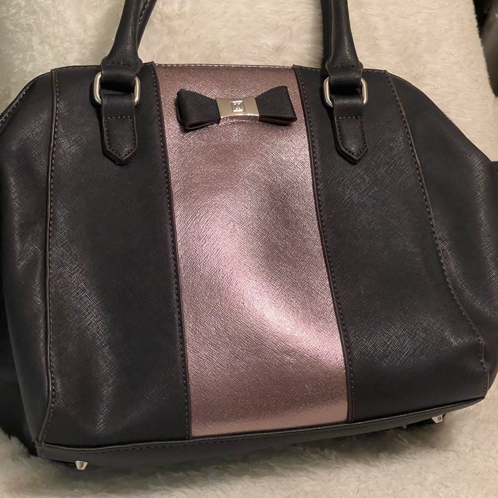NWOT Liz Claiborne satchel with shiny pink front on a black background